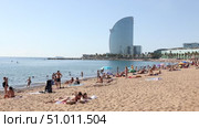 Beach of Barceloneta early morning with background huge Barcelona-W hotel (2022 год). Редакционное видео, видеограф Яков Филимонов / Фотобанк Лори