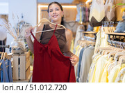 Young woman tearing out a new dress. Стоковое фото, фотограф Яков Филимонов / Фотобанк Лори