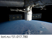 SpaceX Dragon during its docking with the International Space Station. Стоковое фото, фотограф Stocktrek Images, Inc. / ТАСС / Фотобанк Лори