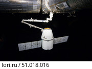 The SpaceX Dragon cargo craft prior to being released from the Canadarm2. Стоковое фото, фотограф Stocktrek Images, Inc. / ТАСС / Фотобанк Лори