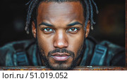 A close-up captures a man with distinctive features looking intently, showcasing emotion and strength amid a gritty urban backdrop. Стоковое AI-видео, аниматор Данила Большаков / Фотобанк Лори