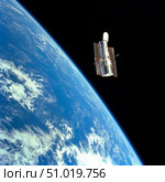 The Hubble Space Telescope with a blue earth in the background. Стоковое фото, фотограф Stocktrek Images, Inc. / ТАСС / Фотобанк Лори