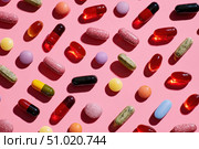 Medicine Pills on Pink Background. Medicinal Capsules and Tablets for Health. Vitamin and health supplement, colorful pills various types multivitamins and tablets. Antiviral, pharmaceutical products. Стоковое AI-изображение, AI-художник Марина Демидюк / Фотобанк Лори