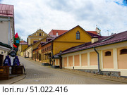 A street with a building that has a sign that says "Cafe". Belarus. Minsk. 05.08.25. Редакционное фото, фотограф Ярославский Максим / Фотобанк Лори