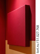 Red acoustic panel improving room sound quality. Стоковое AI-изображение, AI-художник Юрий Поздников / Фотобанк Лори