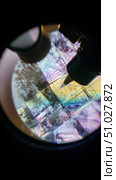 Microscope showing colorful crystal structure with polarization. Стоковое AI-изображение, AI-художник Юрий Поздников / Фотобанк Лори