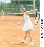 Woman playing tennis against female opponent on tennis court. Стоковое фото, фотограф Яков Филимонов / Фотобанк Лори