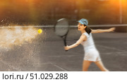 Woman playing tennis against female opponent on tennis court. Стоковое фото, фотограф Яков Филимонов / Фотобанк Лори