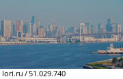 Tokyo, Japan - Oct 13 2024, 4k, panoramic aerial view of Tokyo Bay cityscape in background and the Rainbow Bridge, in the foreground is a part of Odaiba Island, Tokyo, Japan. Стоковое видео, видеограф Сергей Богомяко / Фотобанк Лори