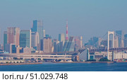 Tokyo, Japan - Oct 13 2024, 4k, panoramic aerial view of Tokyo Bay cityscape in background and the Rainbow Bridge, in the foreground is a part of Odaiba Island, Tokyo, Japan. Стоковое видео, видеограф Сергей Богомяко / Фотобанк Лори