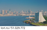 Tokyo, Japan - Oct 13 2024, 4k, panoramic aerial view of Tokyo Bay cityscape in background and the Rainbow Bridge, in the foreground is a part of Odaiba Island, Tokyo, Japan. Стоковое видео, видеограф Сергей Богомяко / Фотобанк Лори