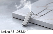 Wearable Air Purifier Necklace on White Background. Стоковое AI-изображение, AI-художник Katsiaryna Repich / Фотобанк Лори
