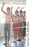 Group of girls ballerinas will learn to stand in third position during a ballet rehearsal. Стоковое видео, видеограф Яков Филимонов / Фотобанк Лори