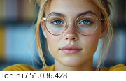 Thoughtful Woman with Blue Eyes and Glasses in Yellow Attire for Intellectual Pursuit Poster. Стоковое AI-видео, аниматор Данила Большаков / Фотобанк Лори