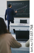 A Professional Presentation in a Modern Classroom: An Engaging Lecture on Data Analysis and Financial Trends Demonstrated with Graphical Insights. Стоковое AI-видео, аниматор Владимир Федоров / Фотобанк Лори