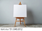 Blank white canvas on an easel on a wooden stand, a mock-up on a neutral background. Empty space for text or design. Web banner. Landscape artist easel painter, stand, frame. Sign Painting Mockup. Стоковое AI-изображение, AI-художник Марина Демидюк / Фотобанк Лори