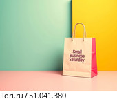Small business saturday shopping bag on colorful background. Стоковое AI-изображение, AI-художник Сергей Бирюков / Фотобанк Лори