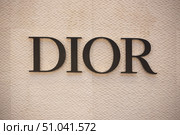 Close-up of Dior logo on the wall of luxury shopping mall Iconsiam. Thailand, Bangkok, (2024 год). Редакционное фото, фотограф Коханова Наталья / Фотобанк Лори