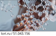 Close-up of a researcher examining molecular structures in a lab setting during daylight hours. Стоковое AI-видео, аниматор Сергей Толмачёв / Фотобанк Лори