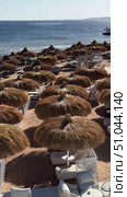 Umbrella, photography, relaxation, horizontal, color image, parasol, tranquility, idyllic, protection, sun, concepts, rug, chair, resting, vertical, happiness, lifestyles, shade, carefree, comfortable, hotel, palm tree, shape, sunbathing, swimming pool, towel, attire, chic, detailed, landscaped, loneliness, serene, simplicity, women, aesthetic, black hair, caribbean, discovery, elegance, headgear, layer, lying down, open, people, repetition, young adult, barefoot, beige, clouds cape, comfort, dreamlike, element, empty, enjoyment, freedom, hat, head wear, lagoon, lightweight, long hair. Стоковое видео, видеограф Zita Khasanova / Фотобанк Лори