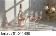 Celebrating with rose wine and elegant glasses in a sunlit kitchen setting. Стоковое AI-видео, аниматор Сергей Толмачёв / Фотобанк Лори