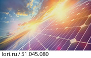 Solar panel capturing and converting sunlight. The suns rays shining through the panel, demonstrating renewable energy generation. Стоковое AI-видео, аниматор Данила Большаков / Фотобанк Лори