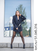 Full length portrait of a young brunette in a formal jacket and black tights. Стоковое фото, фотограф Андрей Аркуша / Фотобанк Лори