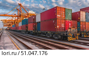 A cargo train carrying numerous containers travels on the railroad tracks. Стоковое AI-видео, аниматор Данила Большаков / Фотобанк Лори