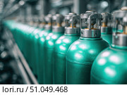 Green oxygen tanks. Bundle of gas cylinder and high pressure gauges, meter, valve. Many argon cylinders with compressed gas for industry, welding. Fuel manufacturing. Liquefied gas production, factory. Стоковое AI-изображение, AI-художник Марина Демидюк / Фотобанк Лори