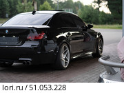 KRASNOYARSK, RUSSIA - July 31, 2025: Black BMW M5 E60. Редакционное фото, фотограф Плотников Дмитрий / Фотобанк Лори