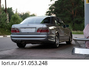 KRASNOYARSK, RUSSIA - July 31, 2025: Silver Mercedes Benz E class W210. Редакционное фото, фотограф Плотников Дмитрий / Фотобанк Лори