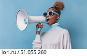 A woman stands wearing sunglasses, holding a megaphone in her hand. She appears confident and ready to make an announcement or convey a message. Стоковое AI-видео, аниматор Данила Большаков / Фотобанк Лори