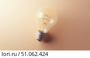 energy spiraling lightbulb ai generated. Стоковое AI-изображение, AI-художник Vectorwin / Фотобанк Лори