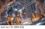 Scientists conduct research in a high-tech laboratory focusing on advanced materials and innovative experiments. Стоковое AI-видео, аниматор Сергей Толмачёв / Фотобанк Лори
