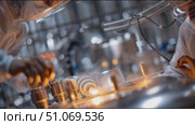 Scientists conduct research in a high-tech laboratory using advanced equipment for innovative experiments. Стоковое AI-видео, аниматор Сергей Толмачёв / Фотобанк Лори
