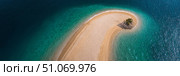 A stunning aerial view of a narrow sandy beach forming a crescent shape, surrounded by vibrant turquoise water. At the tip of the sandbar, a small patch of greenery with palm trees adds a serene tropical touch. The contrast between the golden sand and deep blue ocean creates a visually captivating and peaceful island paradise atmosphere. Стоковое AI-изображение, AI-художник Ксения Чунаева / Фотобанк Лори