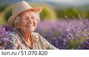 An elderly woman with a straw hat smiles brightly while surrounded by a field of lavender flowers on a sunny day. Стоковое AI-видео, аниматор Данила Большаков / Фотобанк Лори