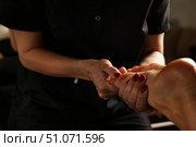 Relaxing Foot Massage Experience Focused on Soothing Techniques Indoors for Ultimate Comfort. Стоковое фото, фотограф Aleksandr Golubev / Фотобанк Лори