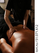 Healing Touch Through Medical Massage in a Serene Indoor Setting Promotes Relaxation and Wellness. Стоковое фото, фотограф Aleksandr Golubev / Фотобанк Лори