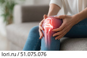 Knee pain icon. Joint pain, Arthritis and tendon problems. Woman in jeans sitting sofa, touching nee at pain point. Mature person feeling unwell, suffering from pain in leg. Red effect painful injury. Стоковое AI-изображение, AI-художник Марина Демидюк / Фотобанк Лори