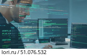 A software developer analyzes code and data in a contemporary office setting. Стоковое AI-видео, аниматор Данила Большаков / Фотобанк Лори