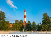 Industrial Factory Chimney Reaching into a Clear Sky. Стоковое фото, фотограф Дмитрий Брусков / Фотобанк Лори