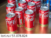KRASNODAR, Russia - October 5, 2022: Metal jars with Coca-Cola drink. Редакционное фото, фотограф Наталия Кирсанова / Фотобанк Лори