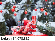 Krasnodar, Russia - December 10, 2021: Various cans or bottles of Coca-Cola on the street during the snow. Редакционное фото, фотограф Наталия Кирсанова / Фотобанк Лори