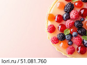A delicate French berry tart with a golden crust encases a stylish berry display. The glossy fruit glaze adds a captivating sheen, making it the epitome of dessert brilliance. Стоковое AI-изображение, AI-художник Nart / Фотобанк Лори