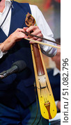 Stringed musical instrument lyre and bow in the hands of a male musician. Стоковое фото, фотограф Наталия Кирсанова / Фотобанк Лори