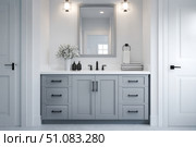 Grey bathroom vanity with white walls, mirror and marble countertop, black hardware. Clean aesthetic background. Home interior room design. Gray cabinet in a bathroom. Стоковое AI-изображение, AI-художник Марина Демидюк / Фотобанк Лори