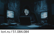 A person wearing a Guy Fawkes mask sits in front of a laptop. Dark room with blue lighting and multiple computer screens. Cables are scattered around the workspace. Редакционное AI-видео, аниматор Nart / Фотобанк Лори