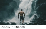 A muscular man walks towards a waterfall in a rocky landscape. The scene captures the power of nature and human strength. Стоковое AI-видео, аниматор Nart / Фотобанк Лори