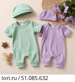 Set of clothes for a newborn girl. Two overalls, lilac and mint colors. Стоковое AI-изображение, AI-художник Ирина Гильмуллина / Фотобанк Лори
